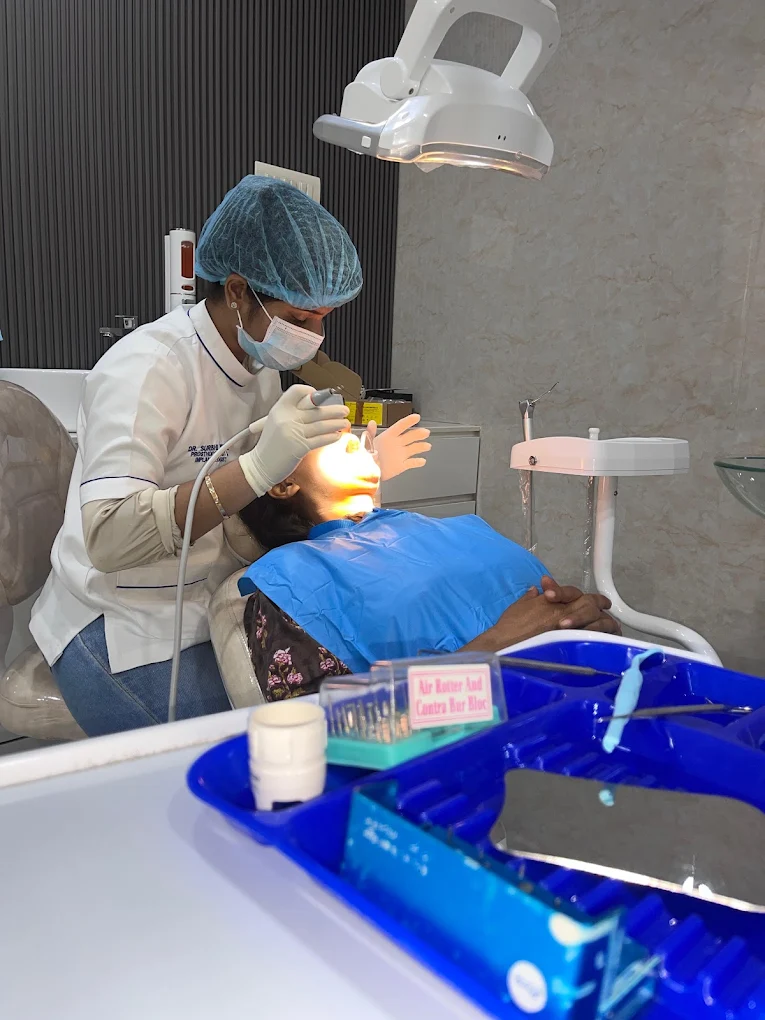 Dentoveda dentist providing dental treatment