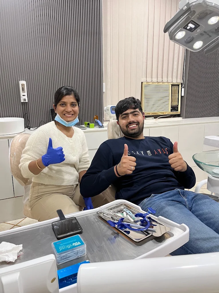 Dentoveda team member with a patient in the clinic